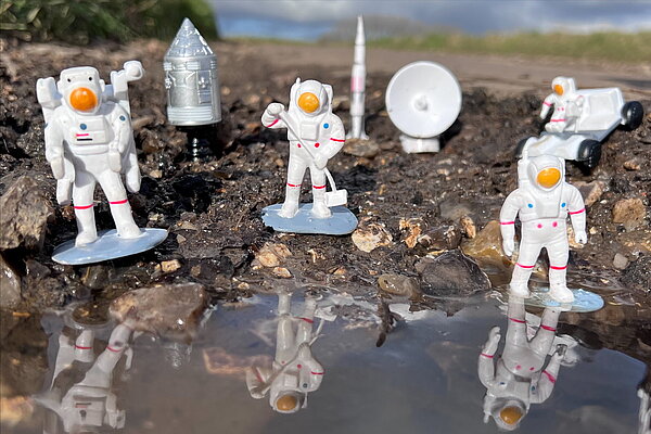 Astronauts in pot hole